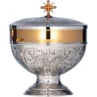 Silver ciborium with vine and grapes chiselled at the base